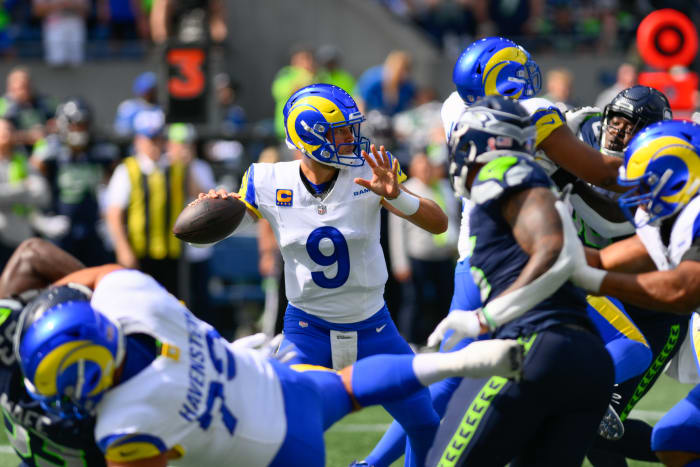 Sep 10, 2023; Seattle, Washington, USA; Los Angeles Rams quarterback Matthew Stafford (9) passes the ball against the Seattle Seahawks during the first half at Lumen Field. Mandatory Credit: Steven Bisig-USA TODAY Sports